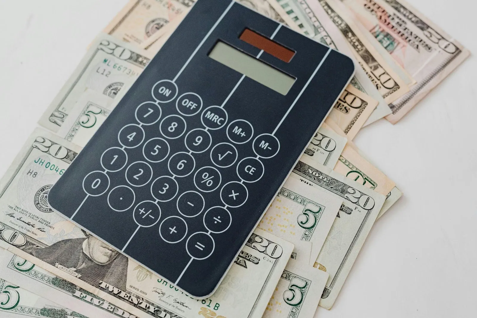 A calculator on dollar bills