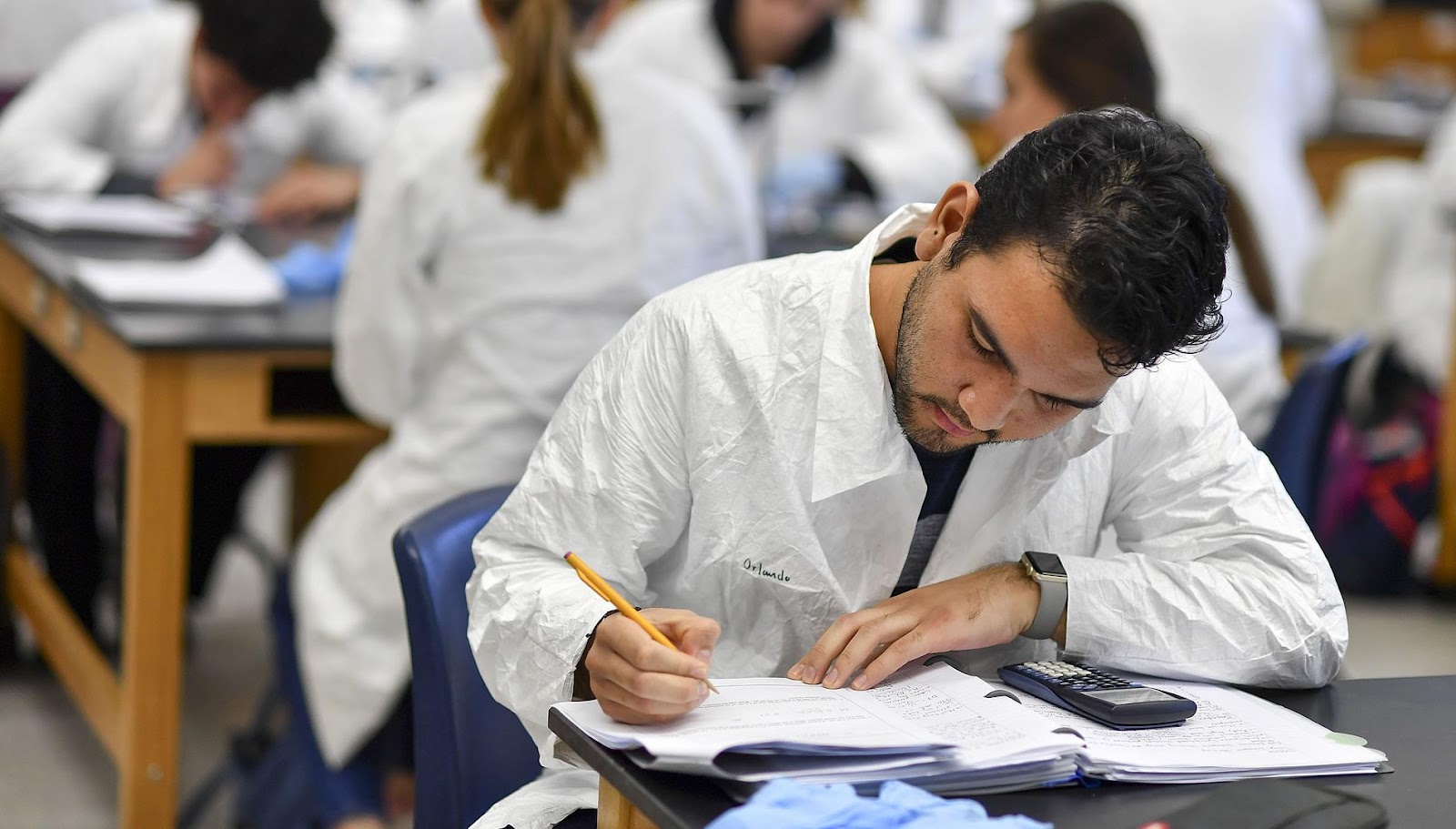 A man working writing down