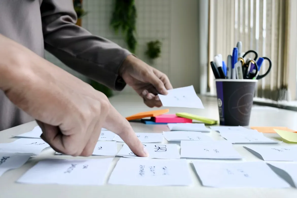 Person writing on white paper