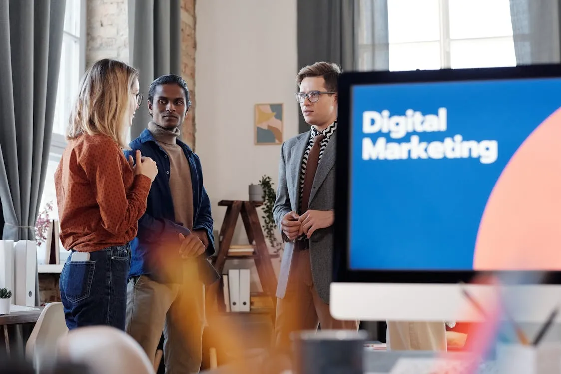 A group of people standing talking