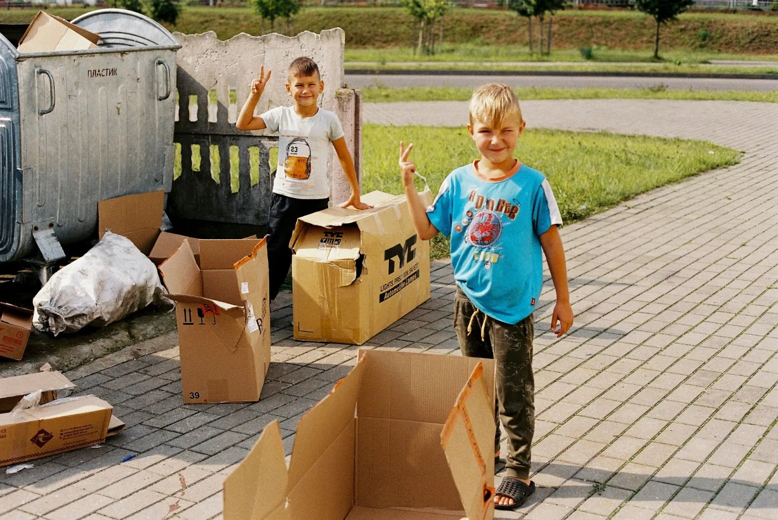 Kids playing with cardboard boxes
