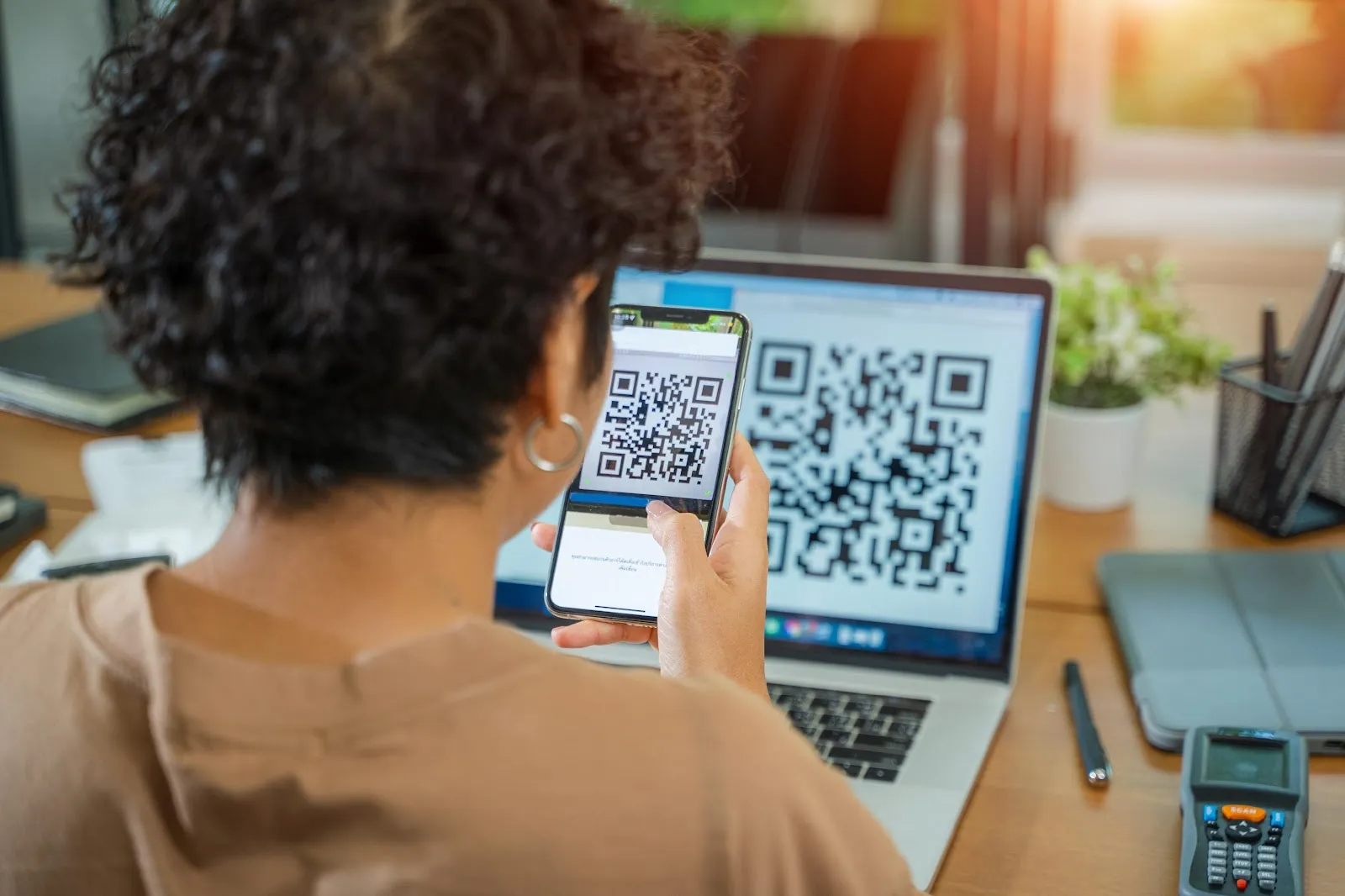 A women scanning a QR code