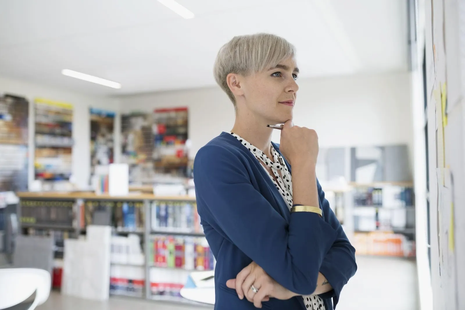 Businesswoman brainstorming at board in office