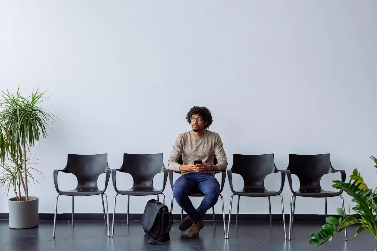 Applicant sitting on a chair