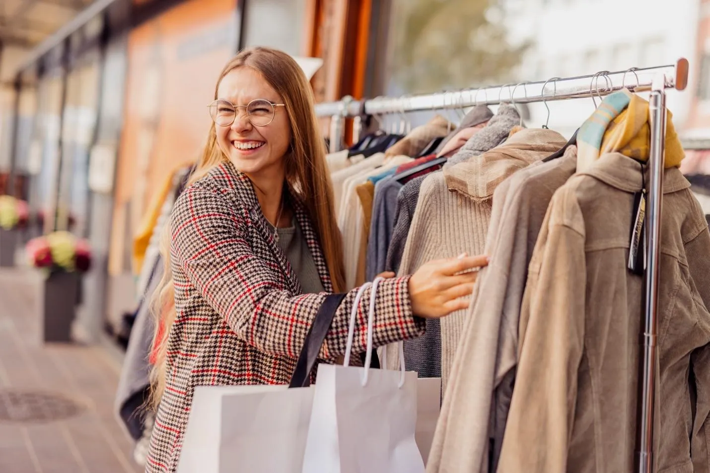 Smiling woman clothes shopping