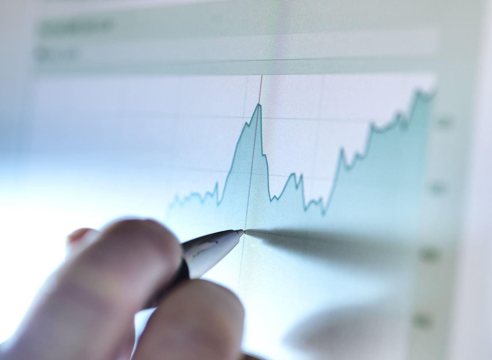 Close-up of a pen writing on a chart