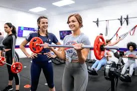 Two women weight training
