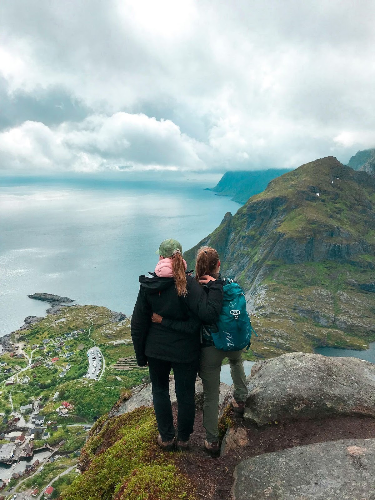 Two women standing on a cliff