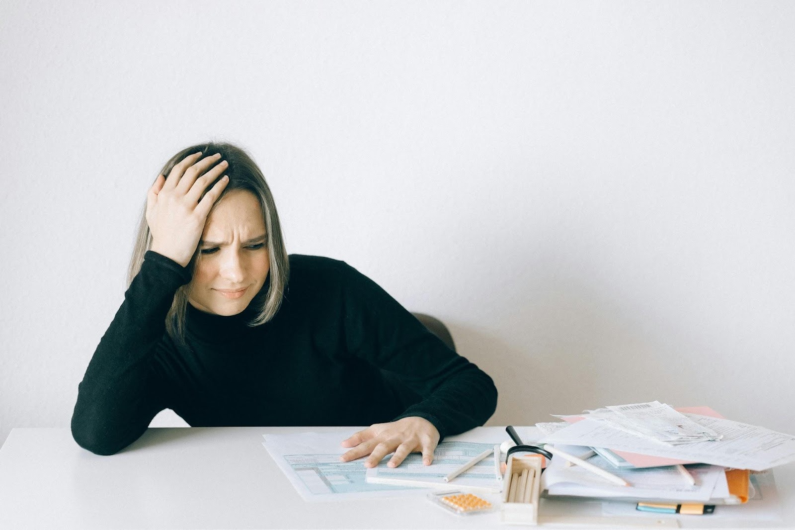 Women stressed looking at paperwork