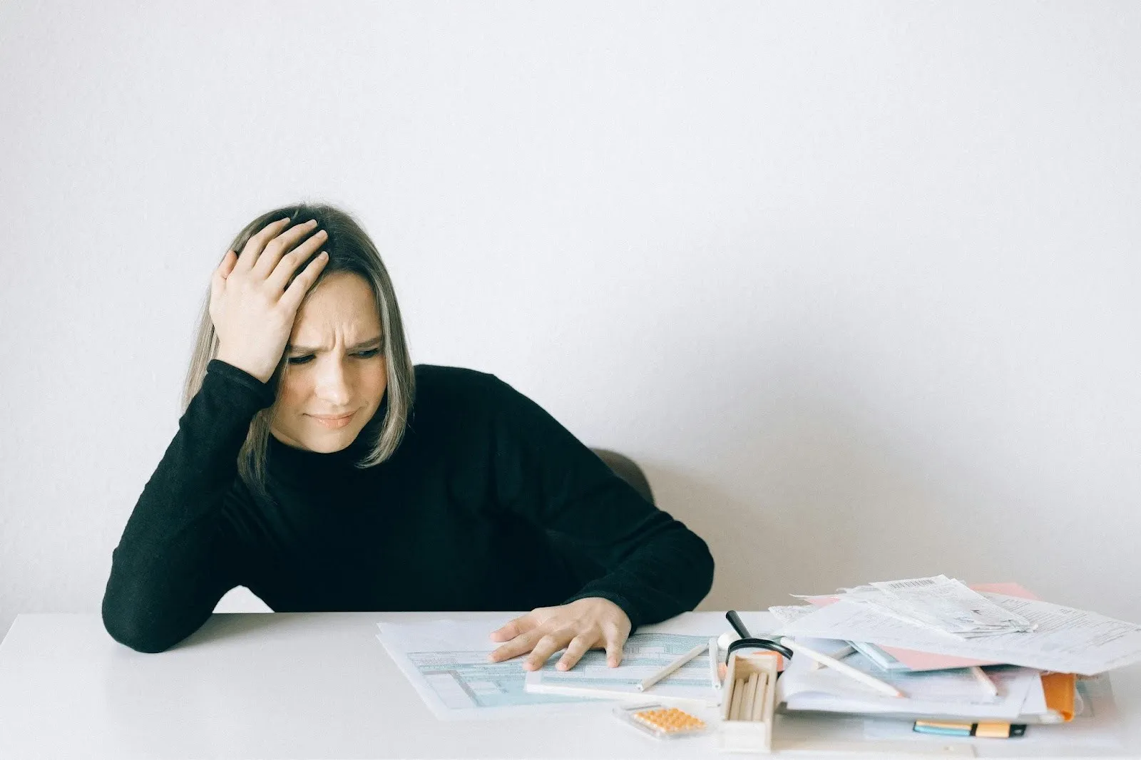 Women stressed looking at paperwork