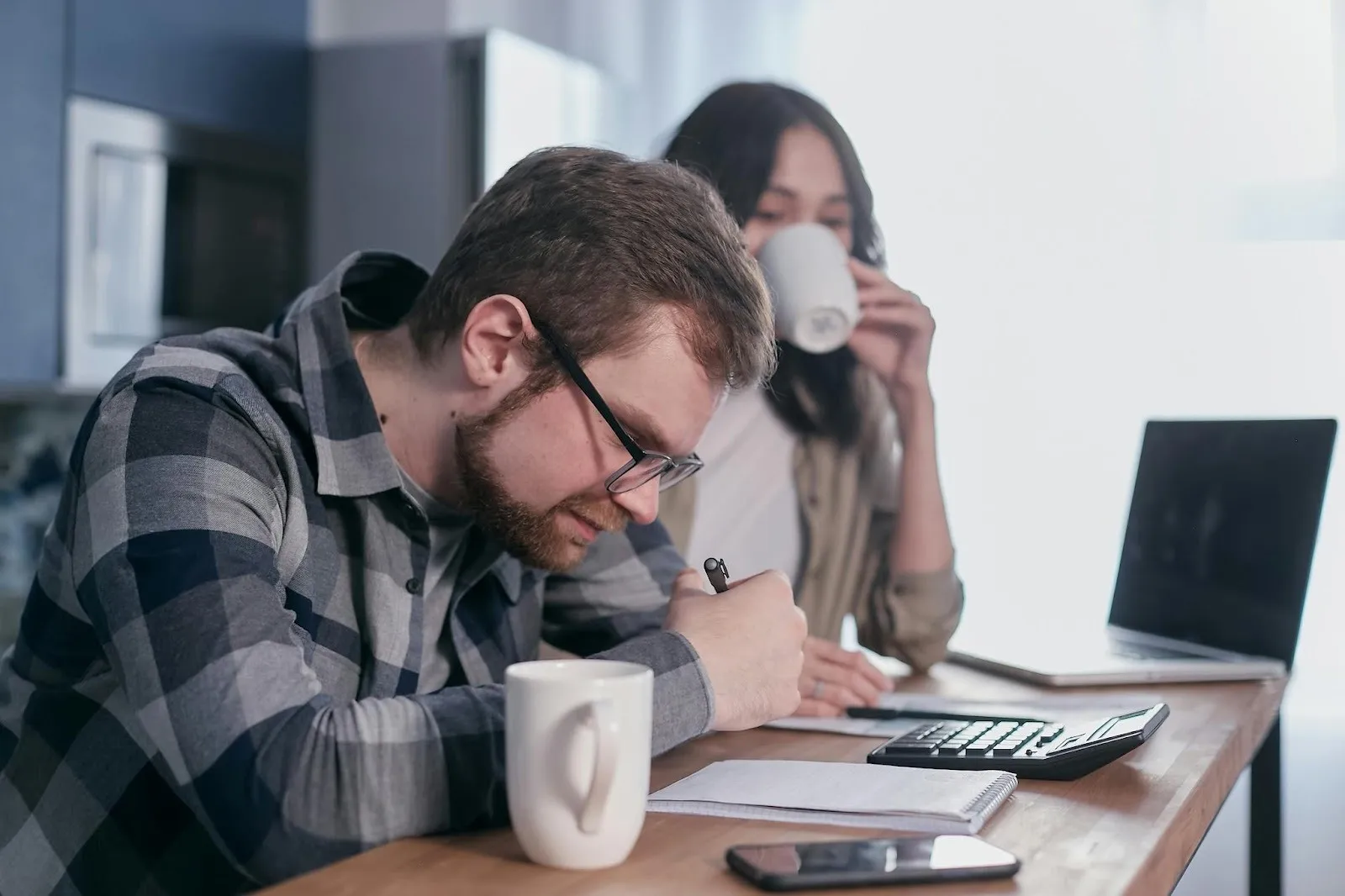 Man looking at a notepad