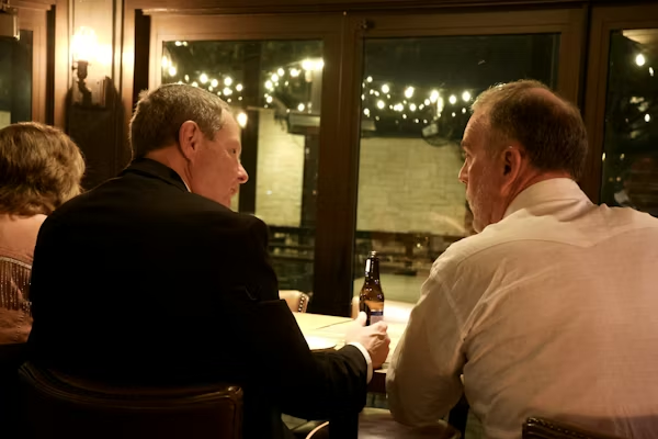 Middle age men sat in a restauran 