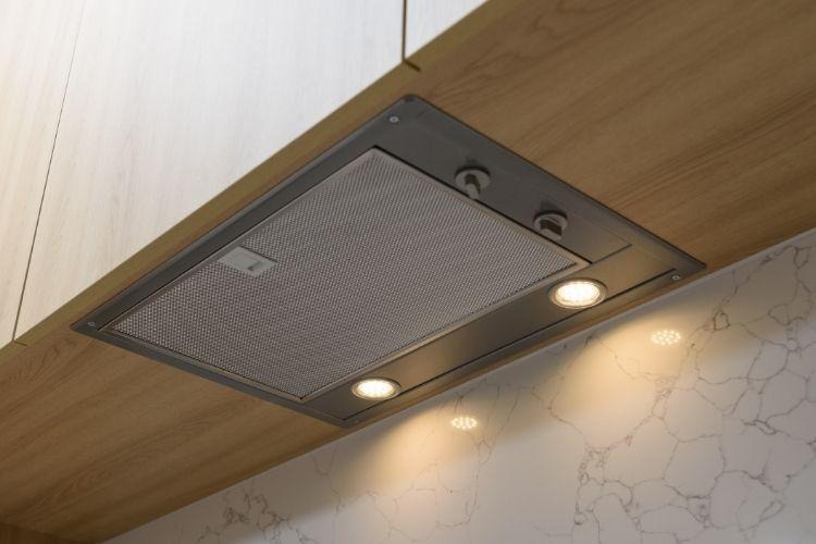 A clean range hood in the kitchen