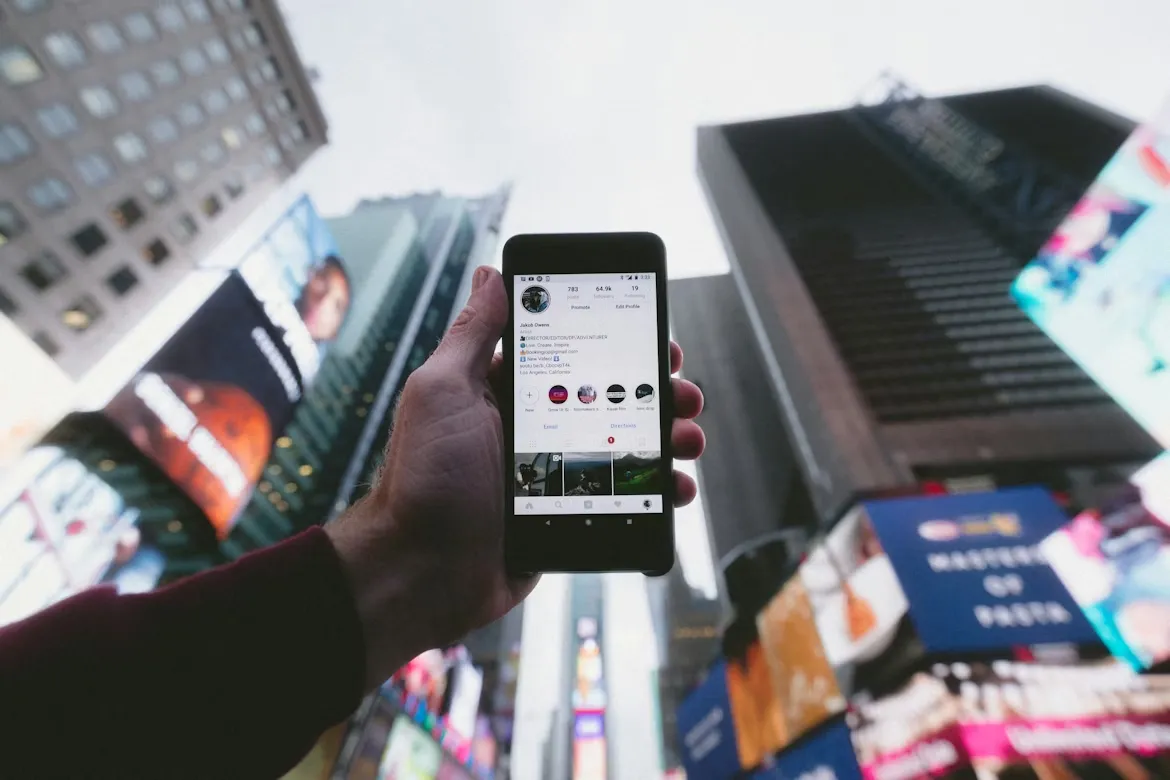 Smartphone with tall buildings in the background