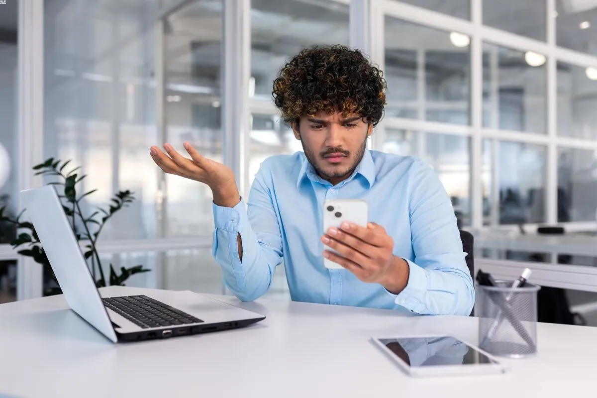 Person using a phone in office
