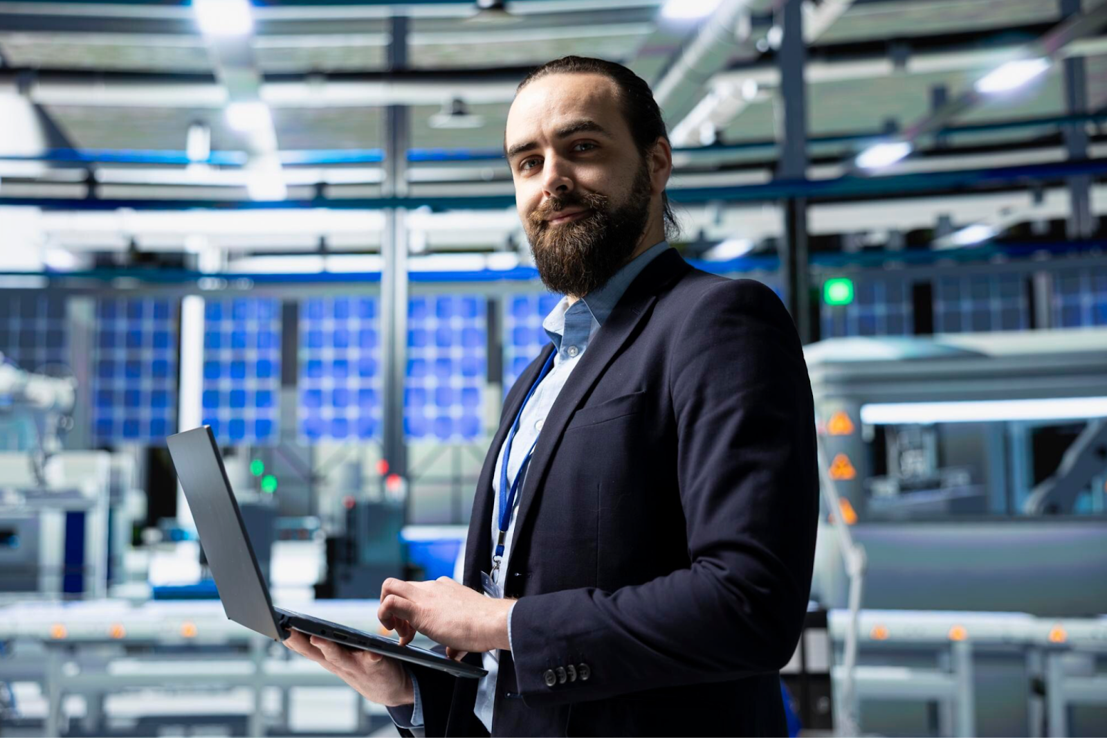 Man in a suit using a laptop