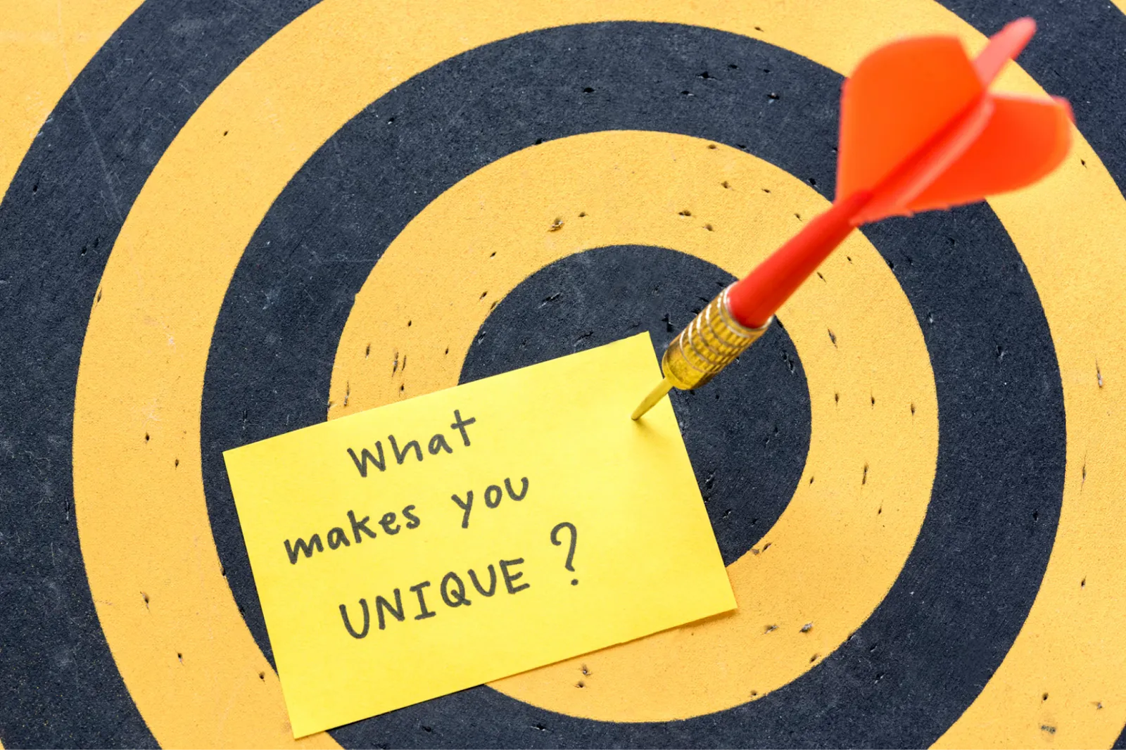 Darts board with post-it note
