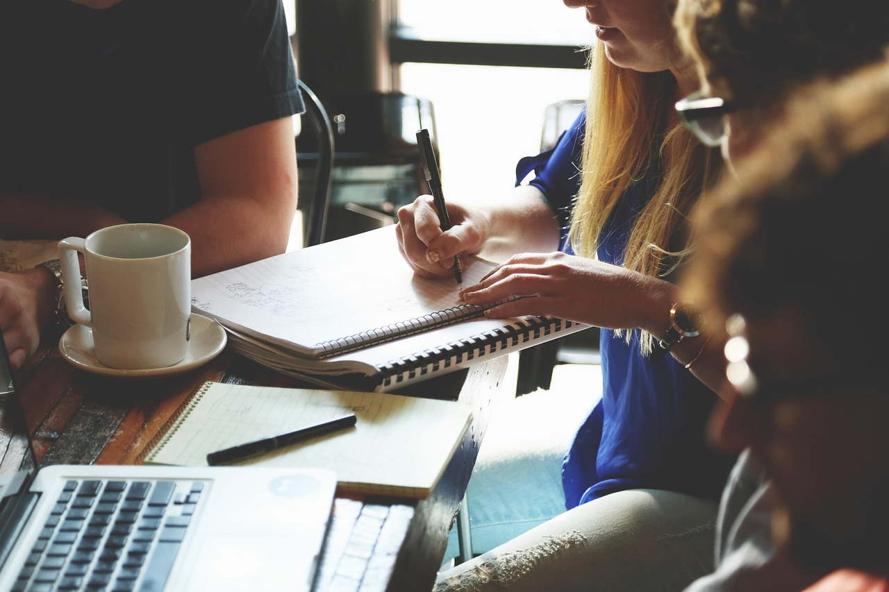 Group of people sat at a desk