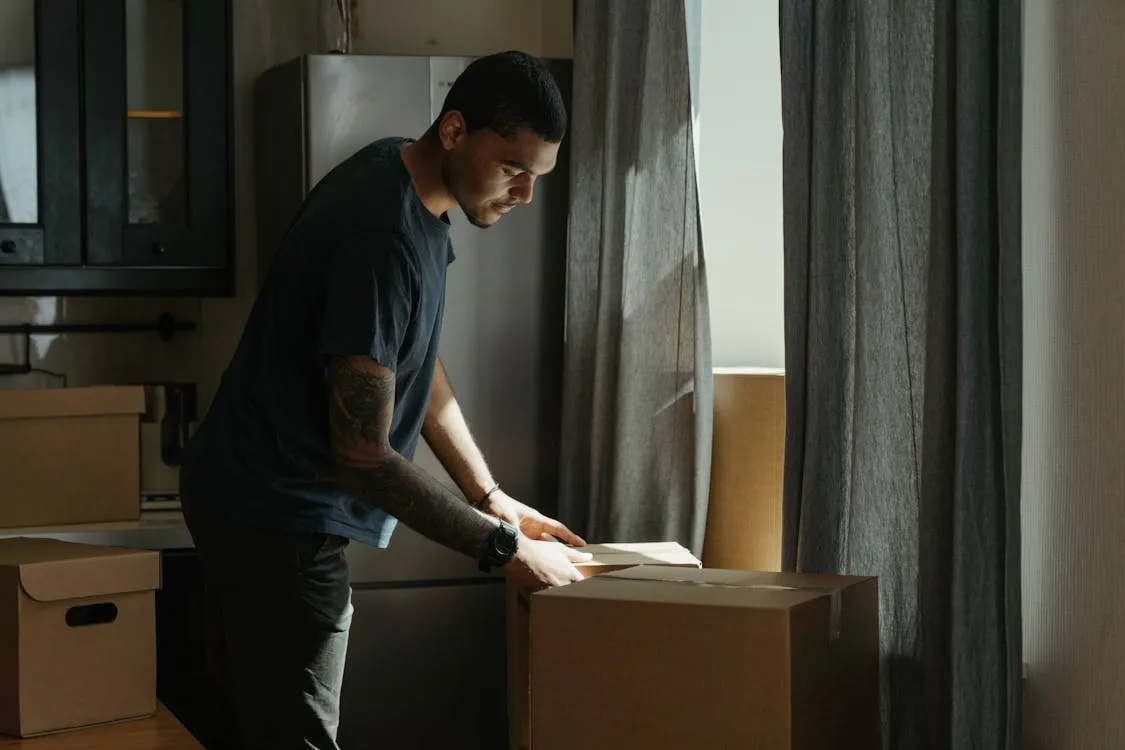 Person packing boxes