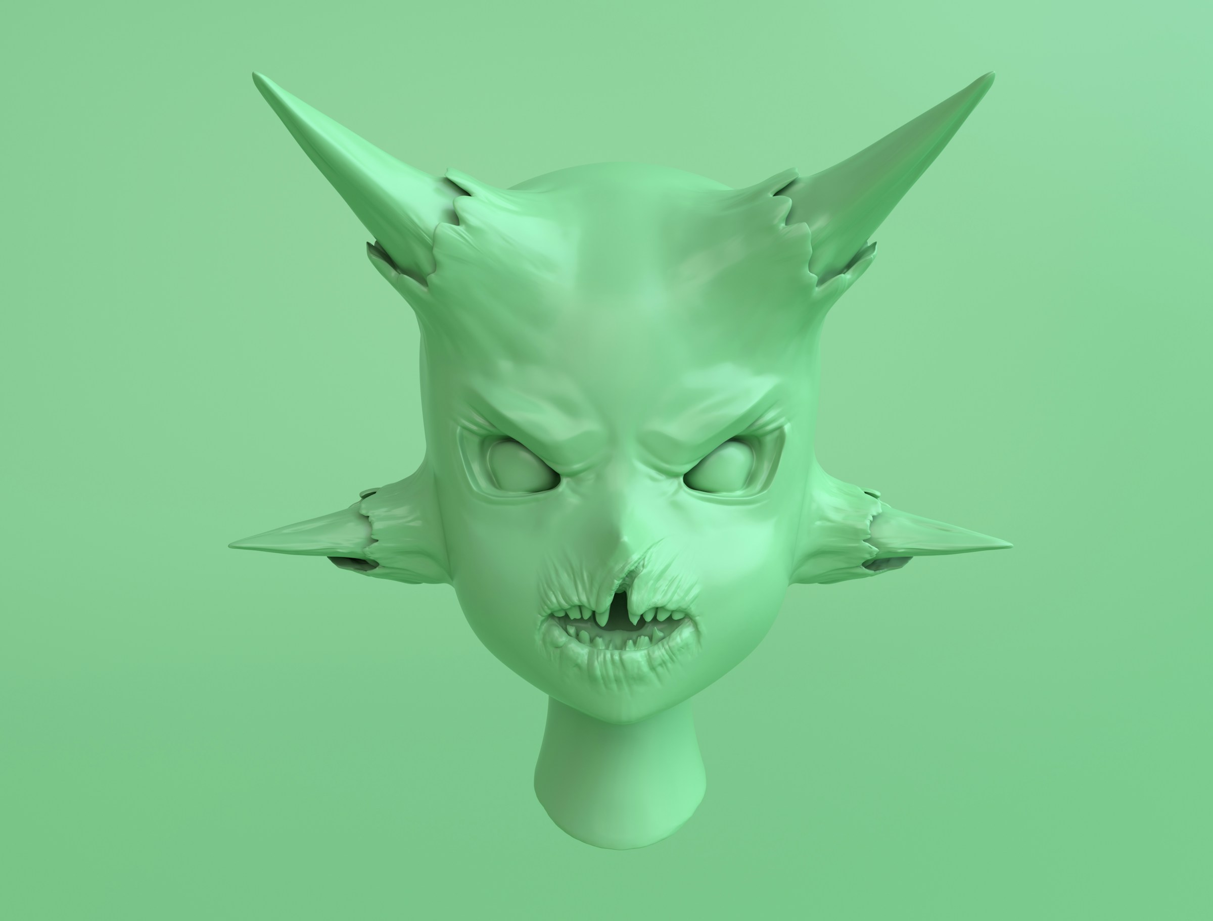 A green head with horns coming out of both the top and sides of the head.