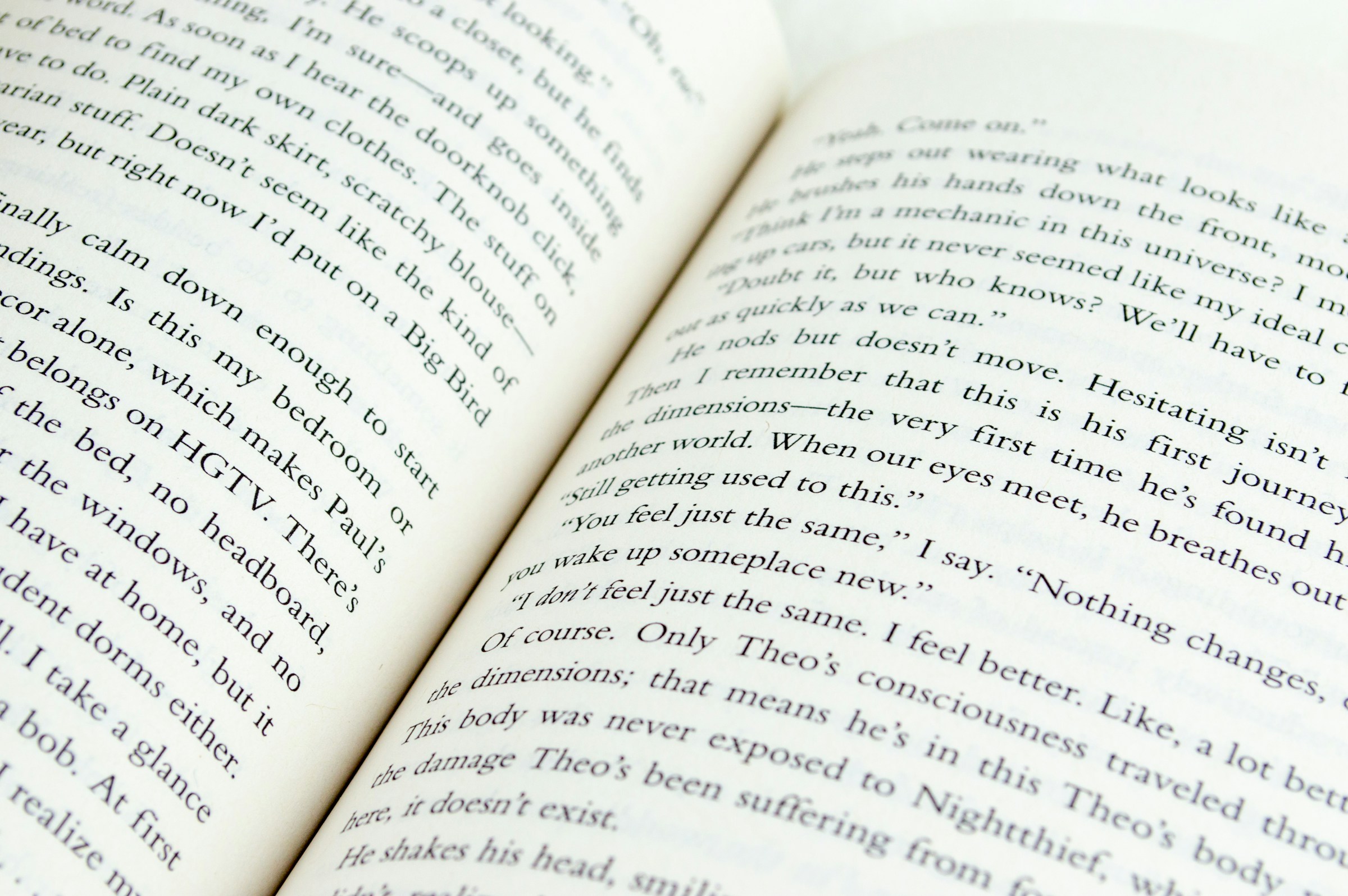 The pages of an open book, showing lots of dialogue using double quotation marks.