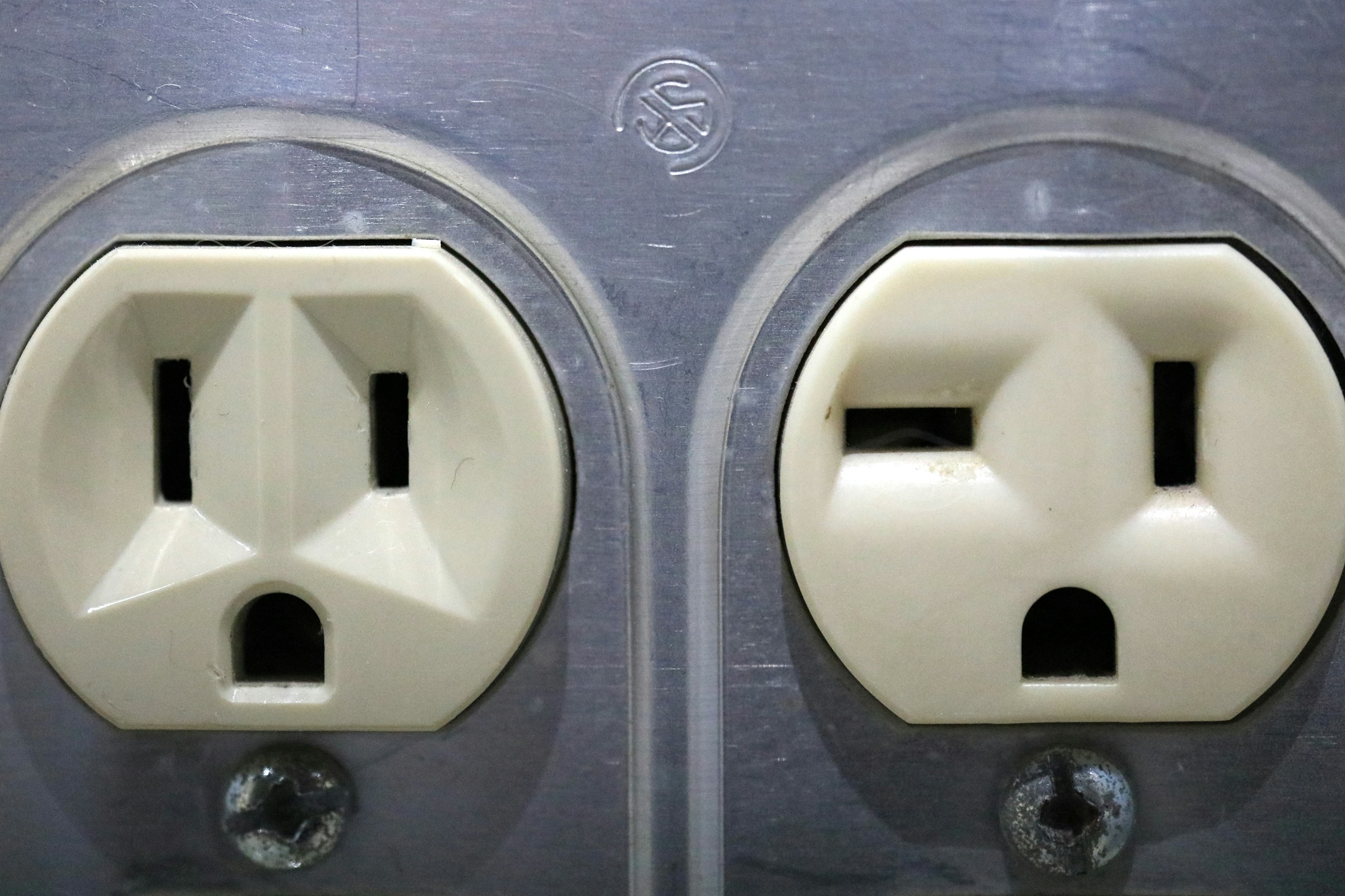 Two electrical outlets side by side look like faces.