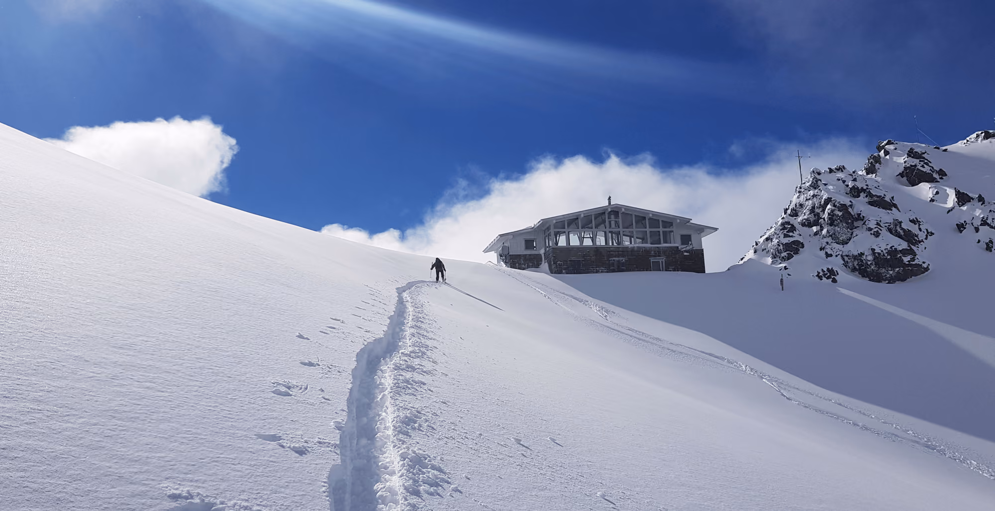 Skinning up to the ridge line where the Craigieburn day lodge is. One of the highest cafes in Craigieburn mountain range.