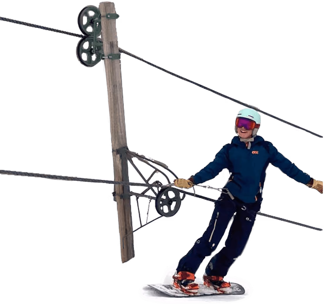 Snow riders going up the mountain in a chairlift