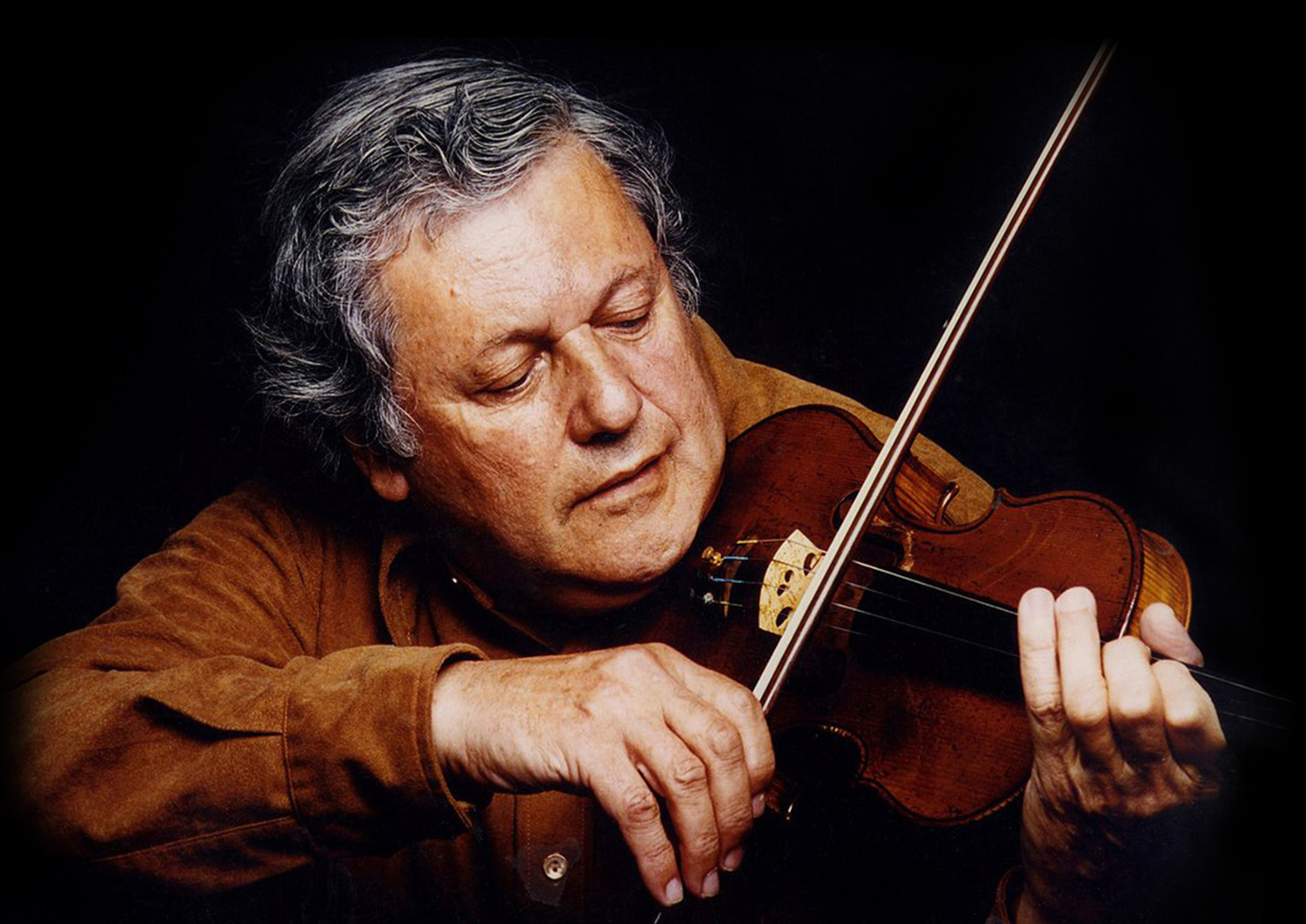 Robert Mann playing violin, as pictured on the 2026 competition page