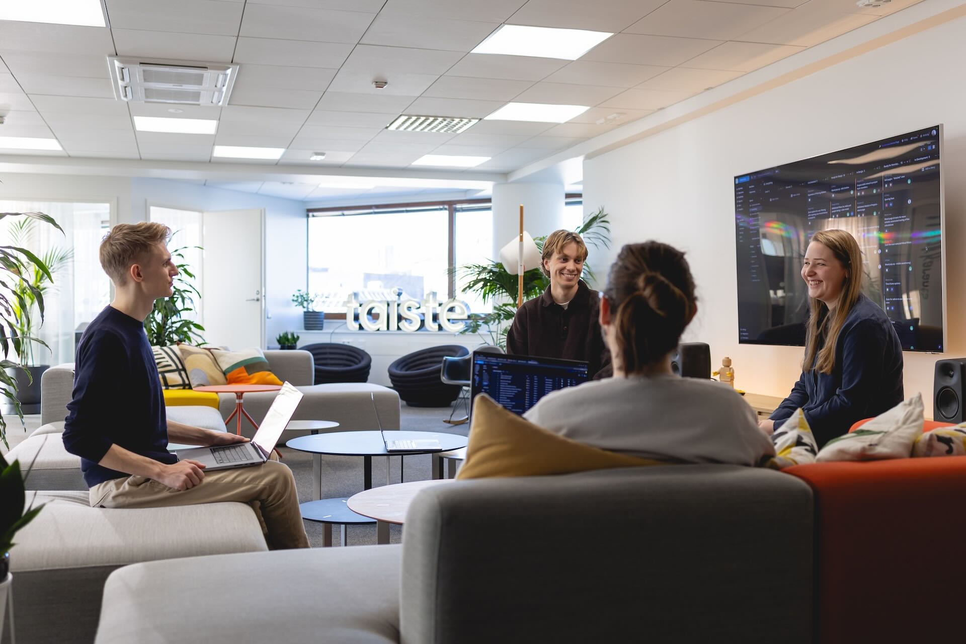 Four Taiste employees having a meeting