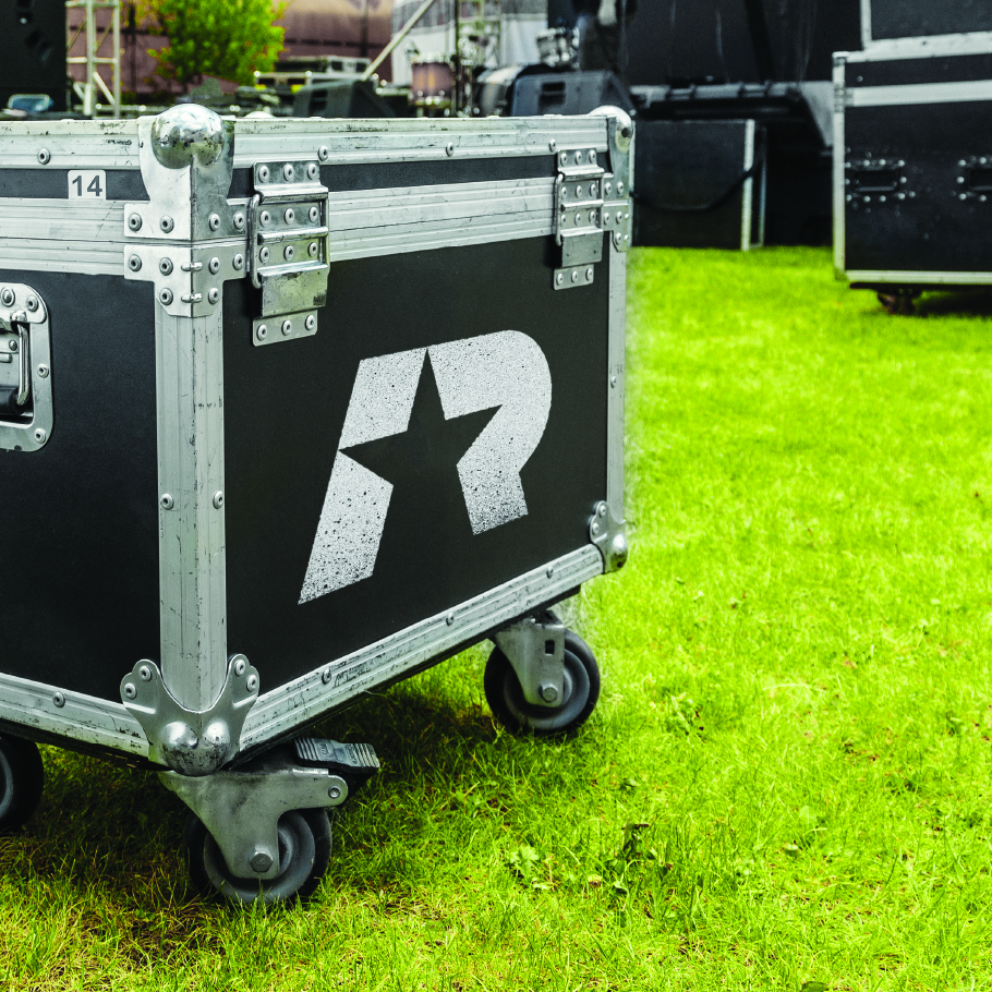 Black and silver heavy-duty equipment case with Army Rappers star logo on green grass outdoors.