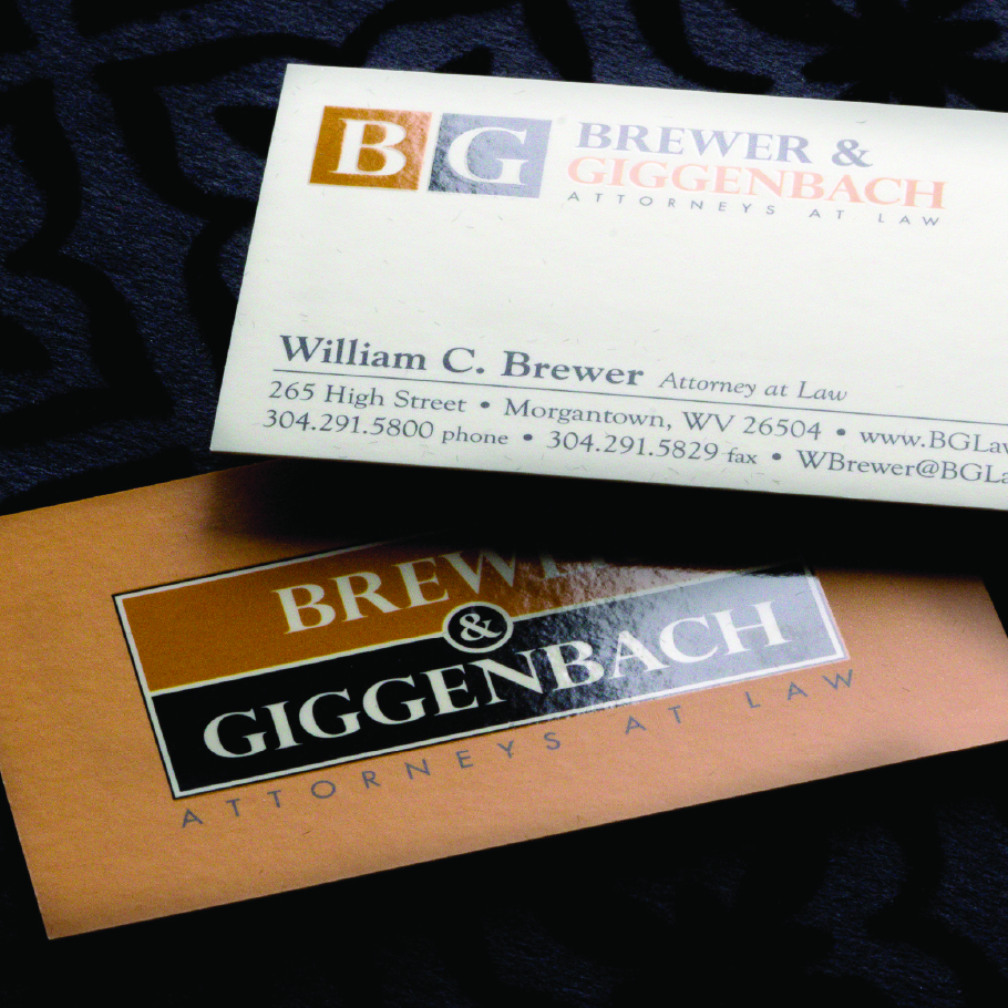 Two business cards for Brewer & Giggenbach Attorneys at Law, one with contact details for William C. Brewer.