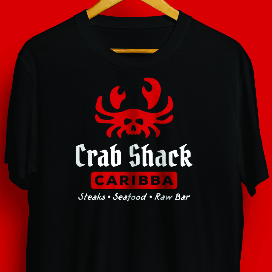 Black t-shirt with a red crab logo and white text reading 'Crab Shack CARIBBA Steaks • Seafood • Raw Bar' on a red background.