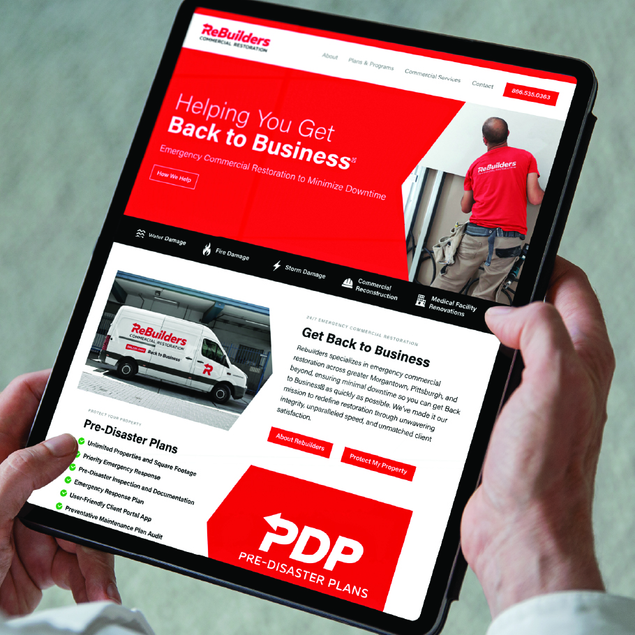 Tablet displaying ReBuilders commercial restoration website with a man in a red shirt, a service van, and information on pre-disaster plans and emergency commercial restoration on a tablet.