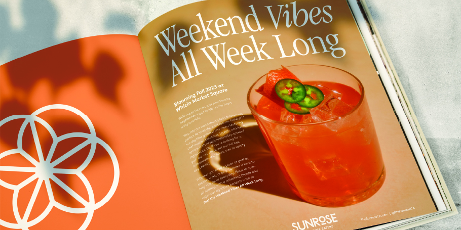 Open magazine with an orange background and a page titled 'Weekend Vibes All Week Long' featuring a cocktail garnished with a jalapeño slice and a piece of fruit.