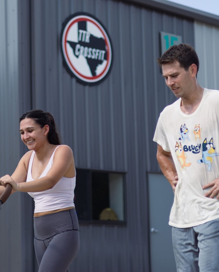Two TTR CrossFit members outside the gym after a workout