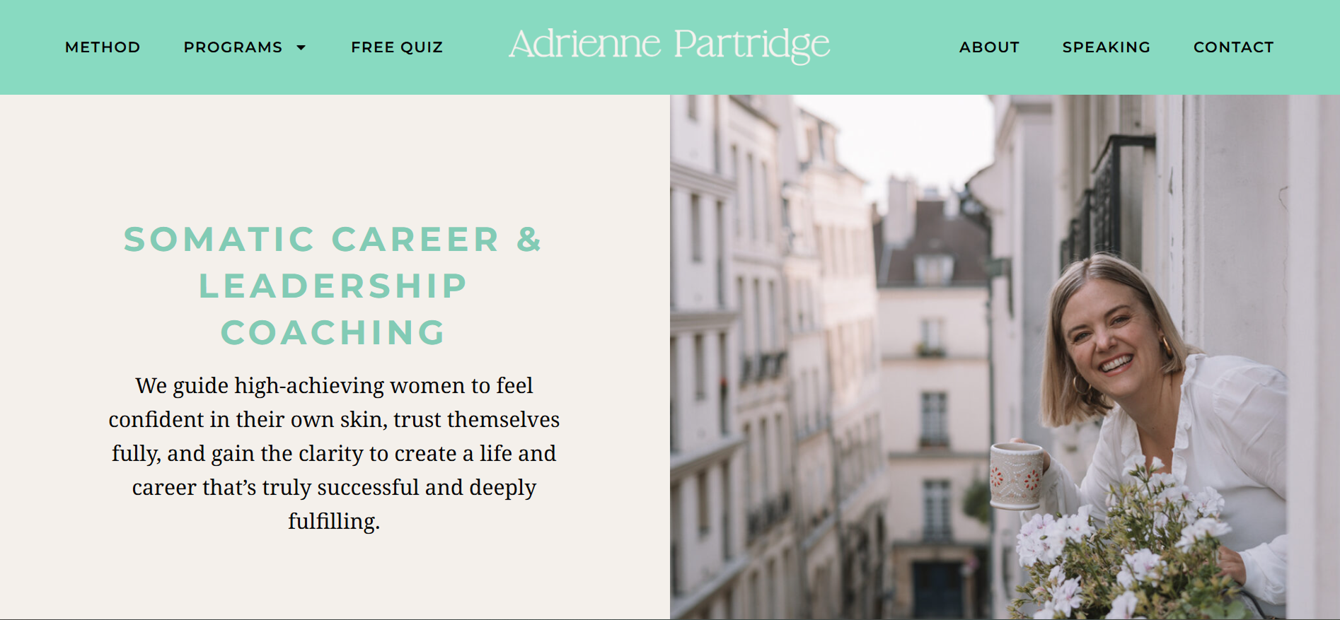Screenshot of original hero. "Somatic Career & Leadership Coaching" on the left and a photo of Adrienne leaning out a window in Paris and smiling at the camera