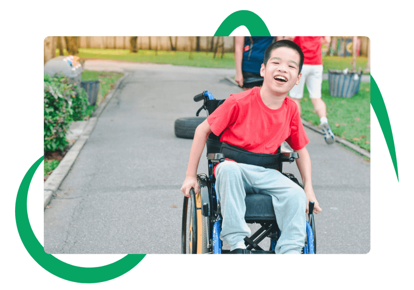 boy in a wheelchair helped by davenport charity 