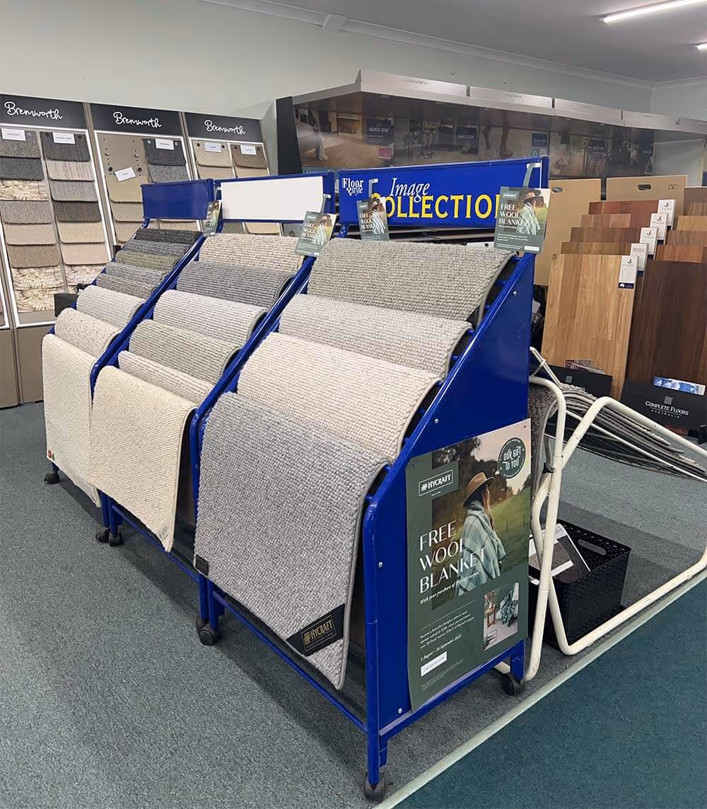 Different kinds of carpet collections displayed in store.