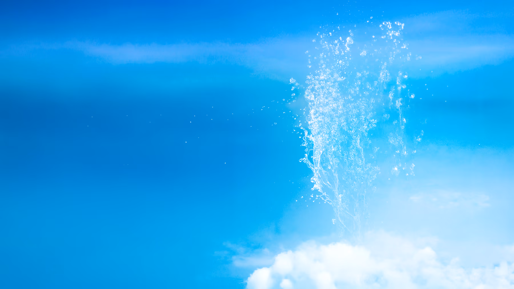 Underwater view of bubbles rising through clear blue water.