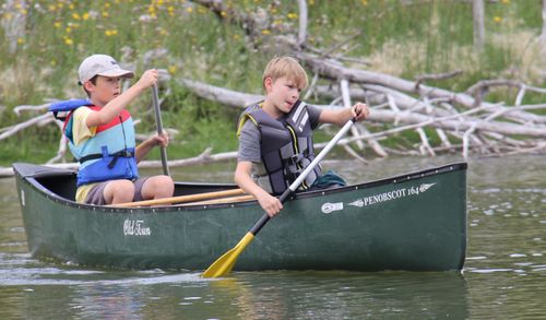 Campers get ready to start canoeing.