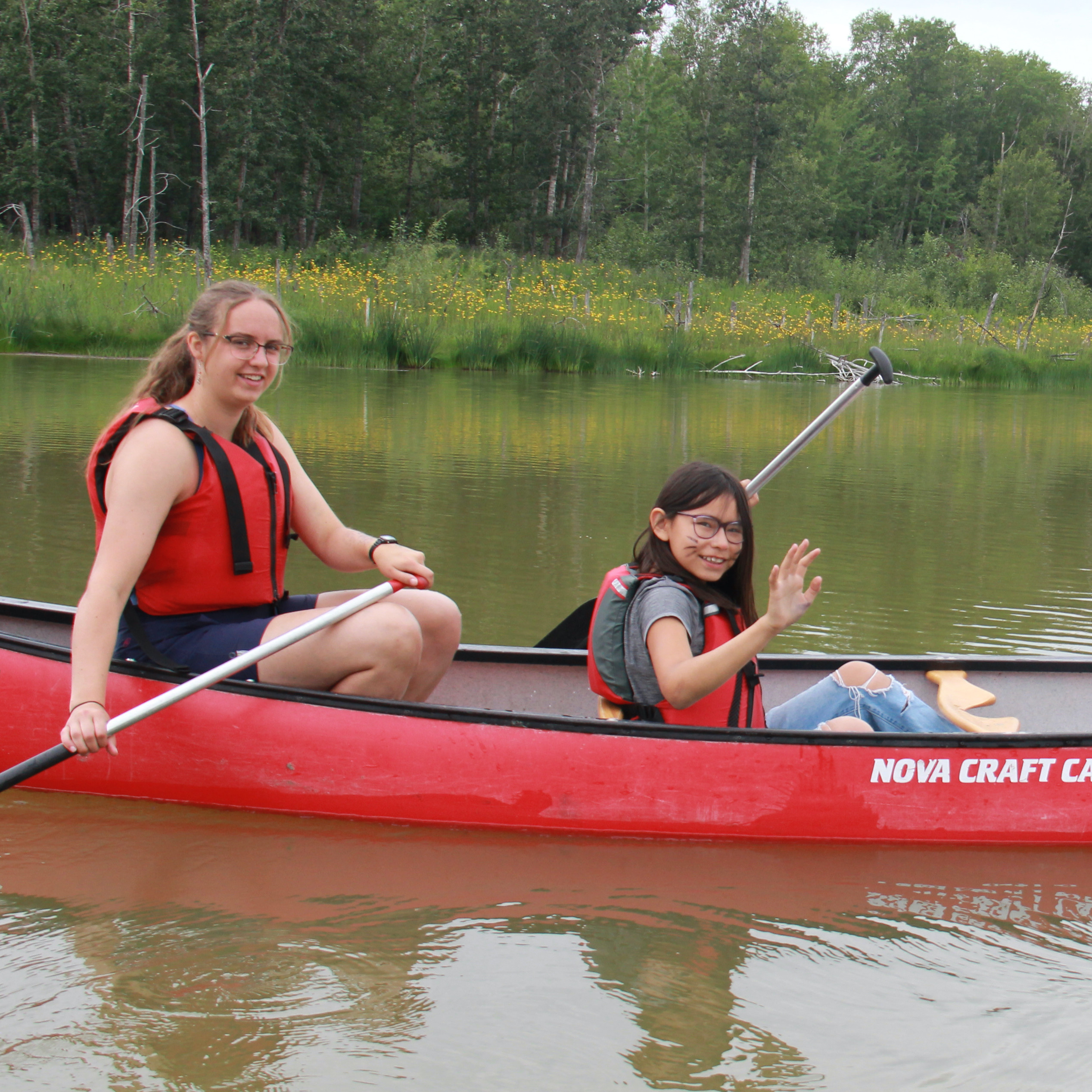 Campers get ready to start canoeing.