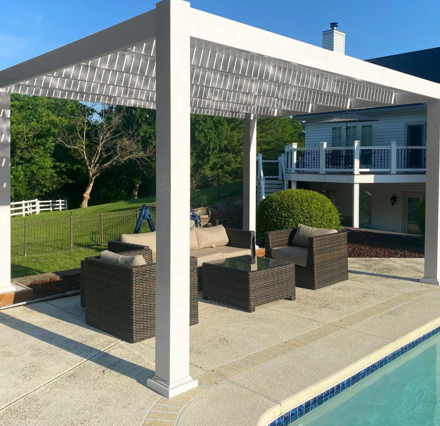 Motorized louvered roof pergola over outdoor seating area