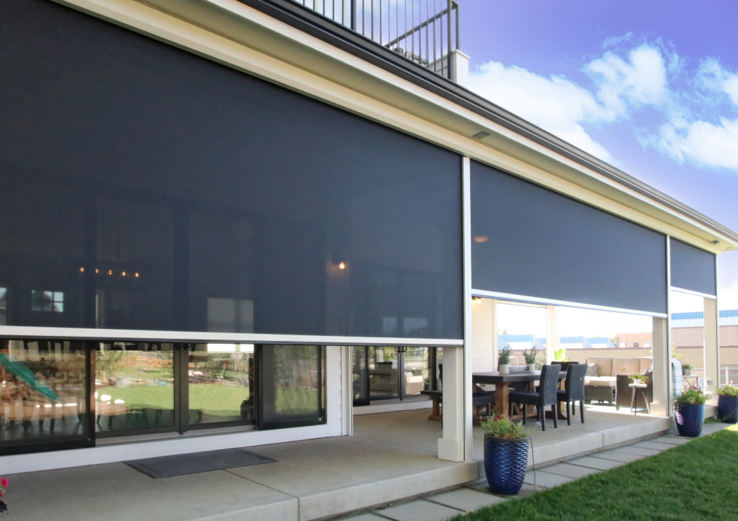 Custom retractable patio shades for a backyard patio