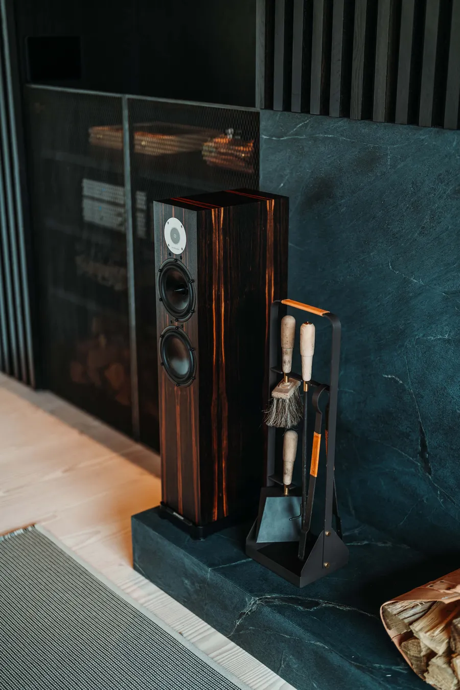 Floor-standing hi-fi speaker beside a fireplace in a Westchester home installed by PSE Audio Visual