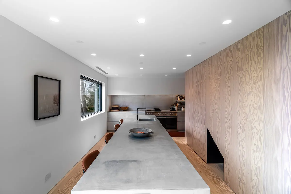 Long kitchen island at the Westchester Residence, a smart home project by PSE Audio Visual