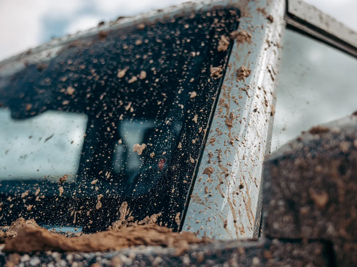 Vehicle windshield exposed to debris and dirt during driving