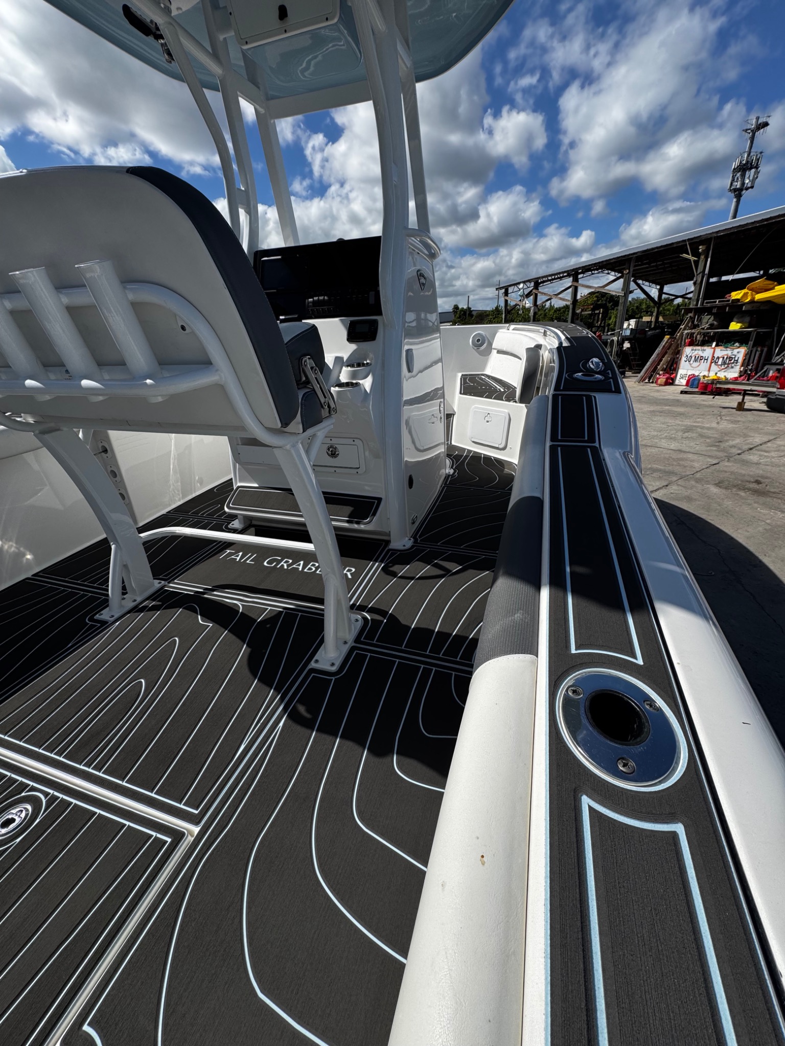 Marine Matt decking on a center-console boat with dark panels, contrasting outlines and a flowing pattern