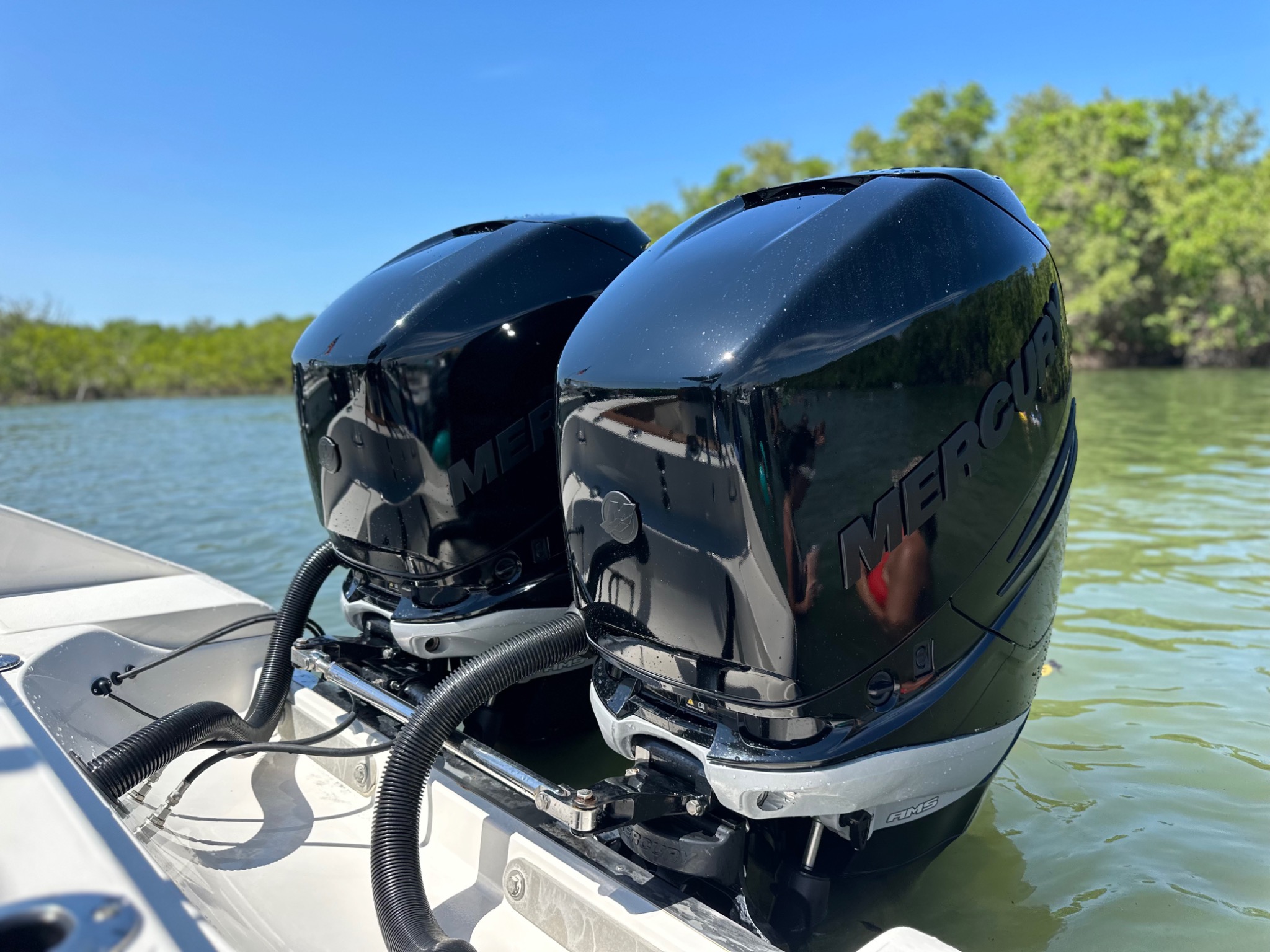 Glossy black custom marine outboard painting by Detail Addict