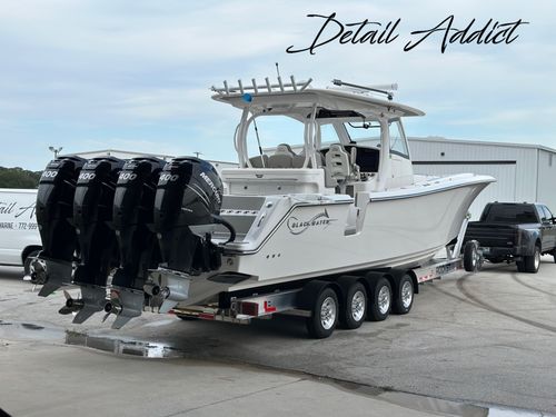 Blackwater boat with four Mercury outboards at Detail Addict